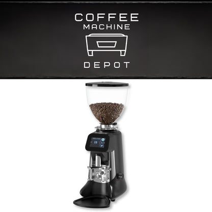 Coffee grinder with coffee beans on a white background, featuring the Coffee Machine Depot logo.